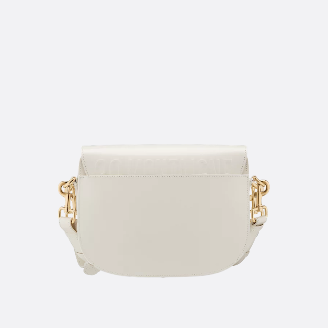 Afrundet crossbody-taske i elfenbensfarvet læder med klap til kvinder