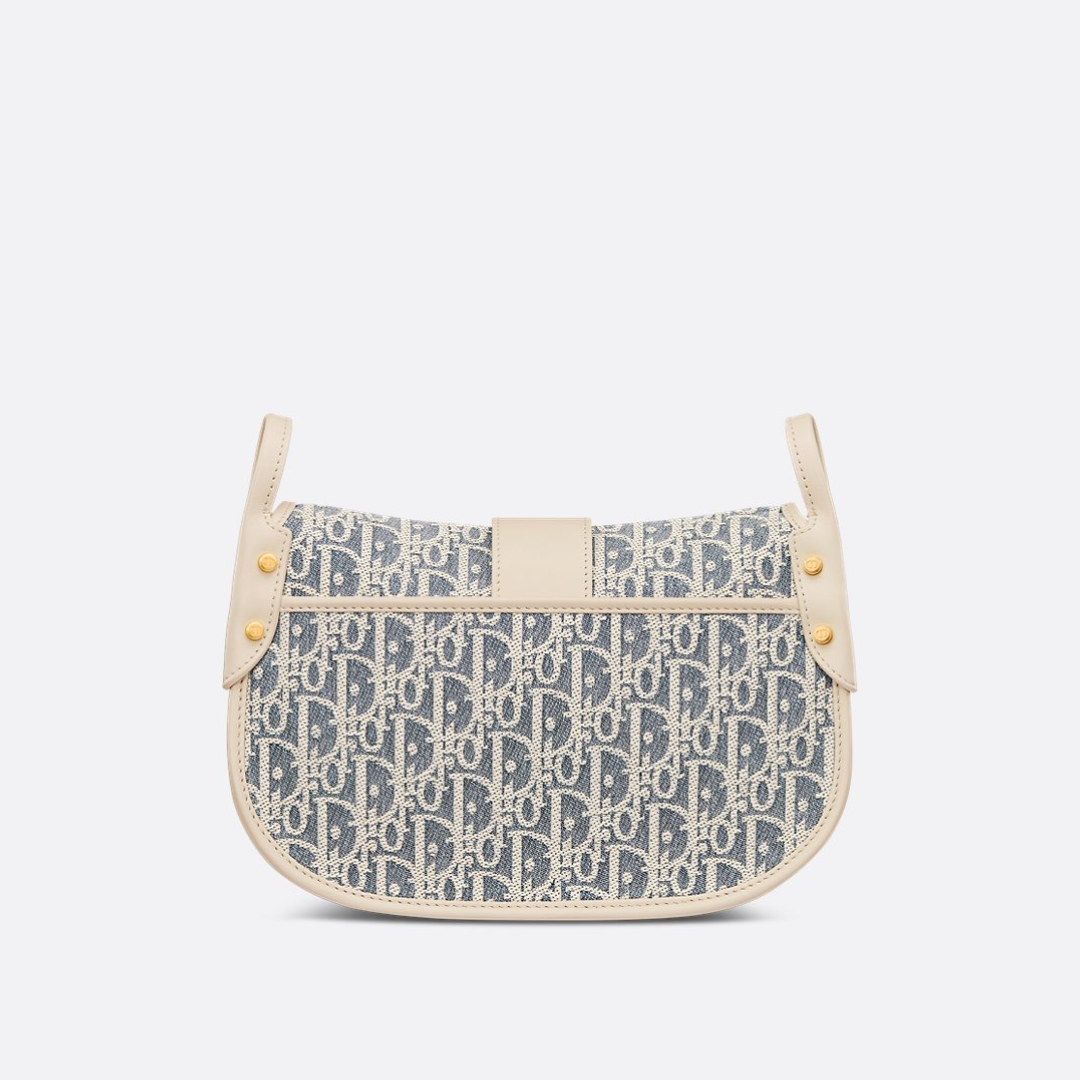 Crossbody-taske i jacquardlærred til kvinder med buet flap